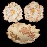 A Royal Worcester ivory ground leaf-shaped dish decorated with flower sprigs and two small