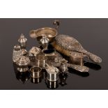 A quantity of silver to include a sauce boat, condiments and napkin rings,