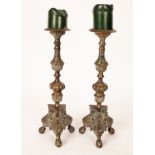 A pair of brass pricket candlesticks, knopped stems on tripod base,
