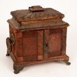 A Regency leather covered casket containing three fitted drawers and ring handles to the sides,