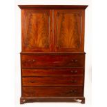A George III mahogany secretaire press, circa 1780, the moulded cornice above two panels,