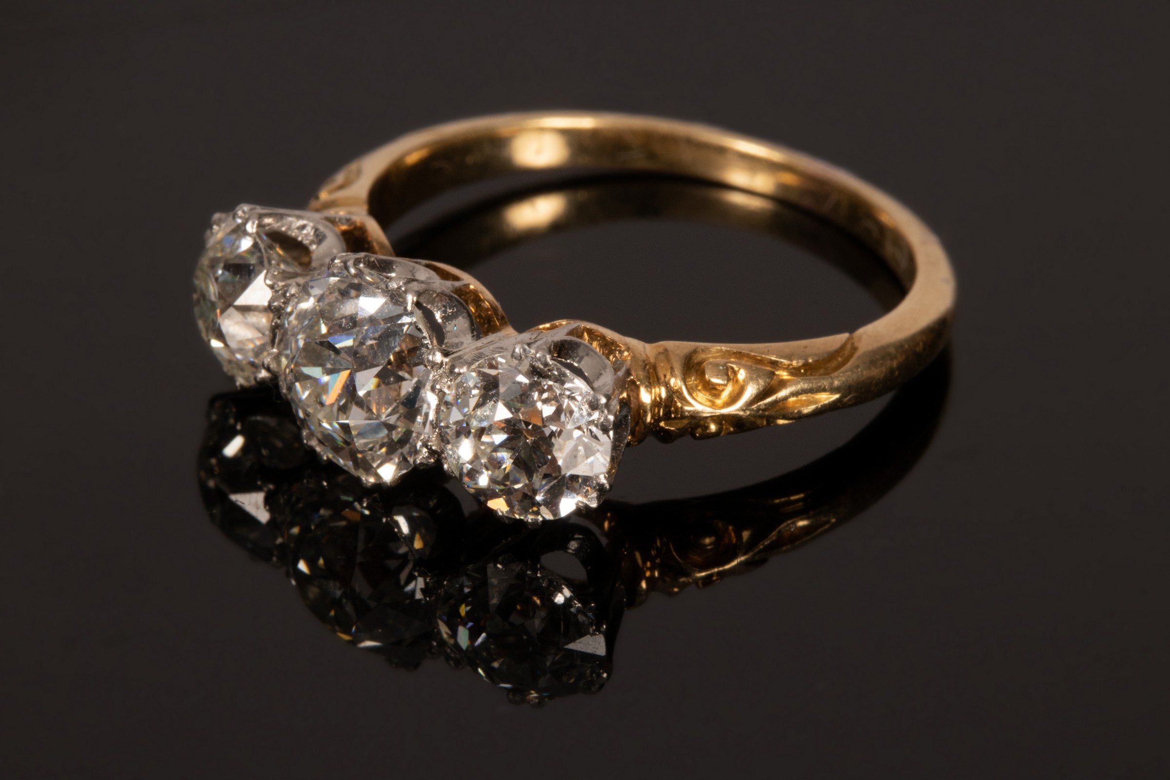 A diamond three-stone ring, the central stone of approximately 1. - Image 2 of 7