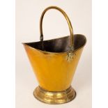 A brass helmet-shaped coal scuttle,