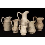 Six saltware jugs, decorated figures in relief,