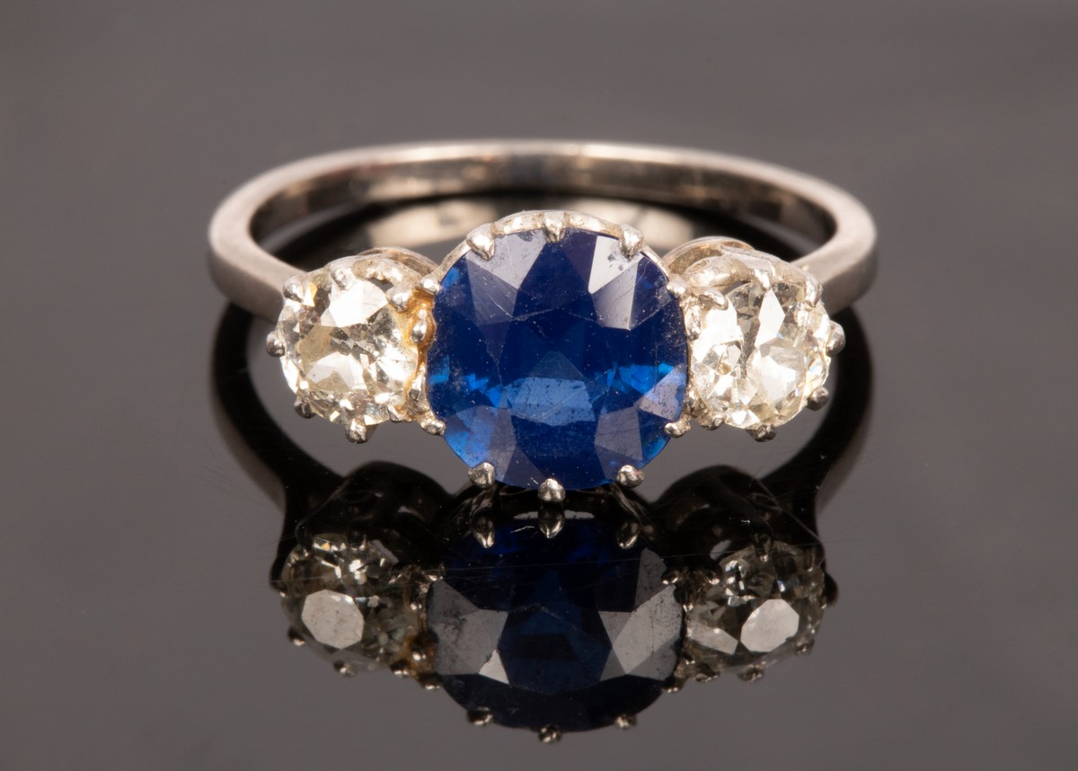 A sapphire and diamond three stone ring,