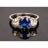 A sapphire and diamond three stone ring,