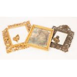 A Florentine style rectangular carved wood wall mirror with gold paint overlay, the plate 24.