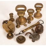 A collection of brass pillar weights, padlocks etc.