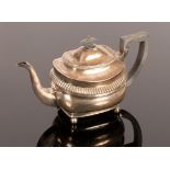 A George III silver teapot, Peter & William Bateman, London 1808, with band of gadrooned decoration,