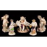 A pair of Continental porcelain figures of cherubs emblematic of Earth and Water,