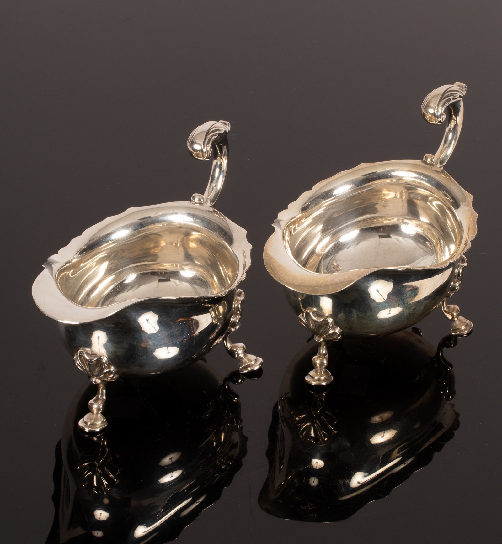 A pair of 18th Century style silver sauce boats, D&J Wellby, London 1925,