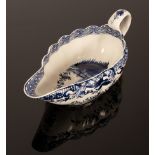 A Derby fluted sauceboat circa 1770, finely painted in an inky blue in the Oriental taste,