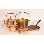 A collection of copper pans, kettles etc.