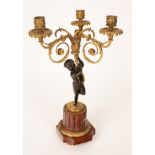 A three-light gilt metal table light with bronze putto support and marble base,