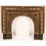 A 20th Century brass fire surround, decorated central lion's head with exposed tongue,