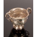 An Edwardian silver two-handled cup, Birmingham 1909, with embossed decoration, 16.