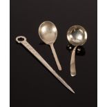 A silver jam spoon, D & J Wellby, London 1924, a small silver ladle and a modern silver meat skewer,