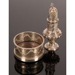 An Edwardian silver wine coaster, Nathan & Hayes, Chester 1905 and a sugar caster dated 1884-1909,