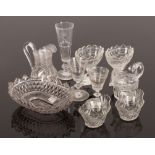A group of Regency style cut glass, comprising two pairs of salts, 10cm high, a shaped oval dish,