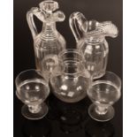 A step cut neck jug and decanter jug, 21cm and 29cm high with panelled sides,