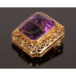 An amethyst pendant brooch, set in 18k yellow gold, the emerald cut stone 19.3mm x 16.5mm x 12.