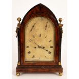 A Regency mahogany cased mantel clock, fitted a twin fusee movement in an arched case,