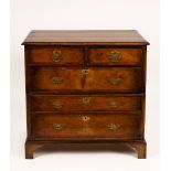 A walnut chest of three long and two short drawers on bracket feet, 95cm wide, 54cm deep,
