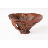 A Chinese Rhino horn carved libation cup, Qing,