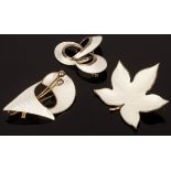 Three white enamel brooches, one of stylised design by Aksel Holmsen, 5cm long,