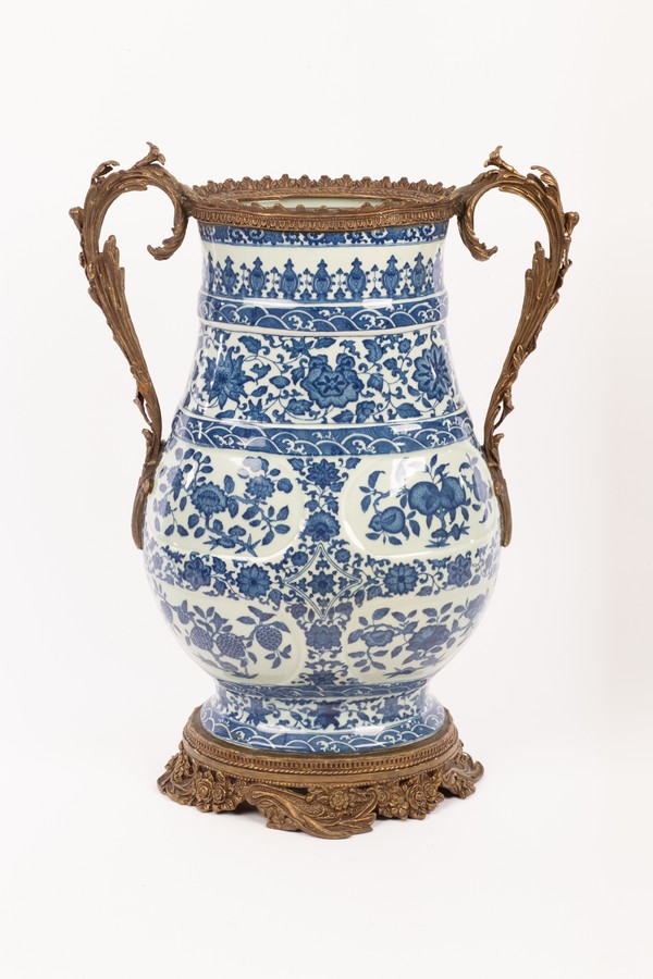 A Chinese blue and white vase, Daqing Qianlong Nianzhi mark, decorated all over with lotus, roses,