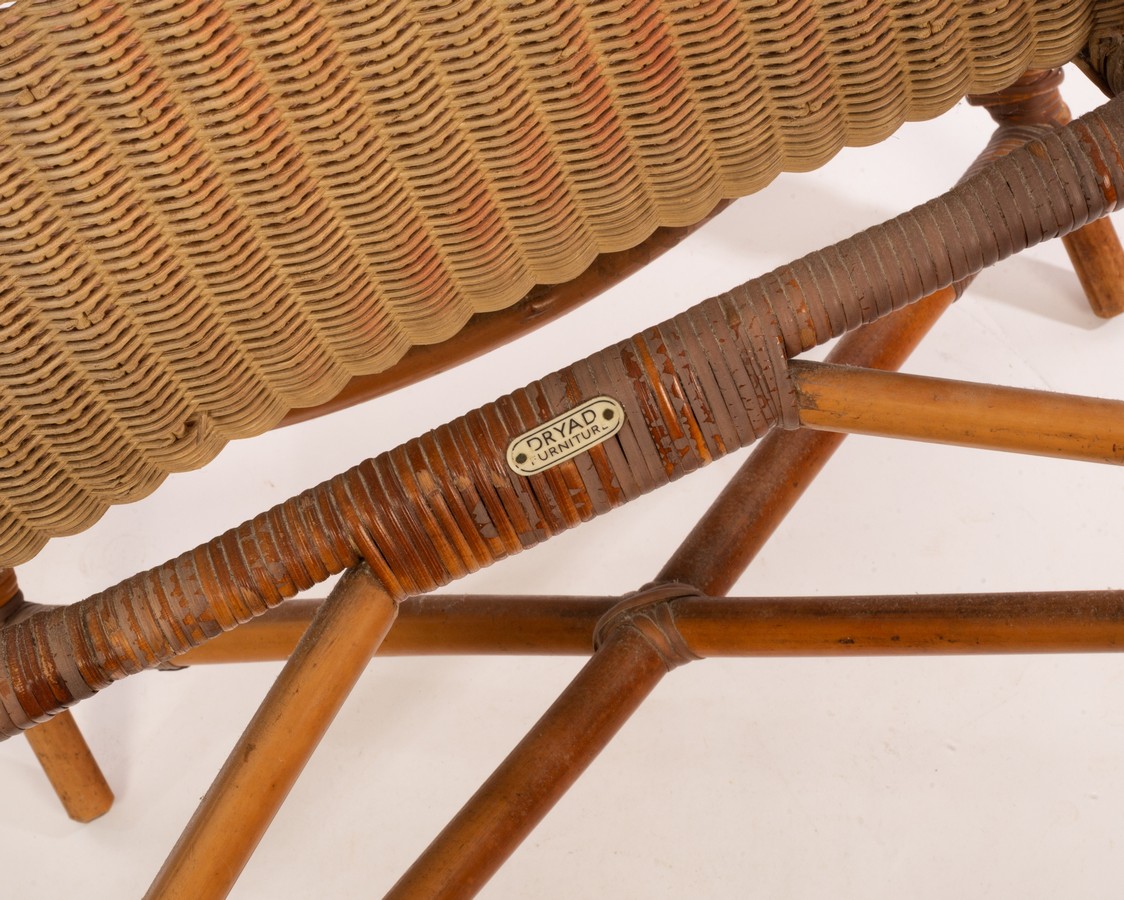 A Dryad rattan chair with arched back and seat on down swept arms, labelled to back, - Image 2 of 2