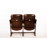 A pair of Thonet theatre seats, the fixed frame with folding seats, enamel numbers 139 and 140,