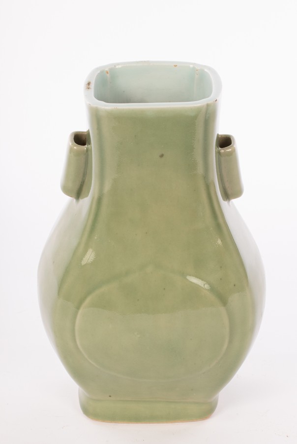 A Chinese monochrome celadon porcelain vase with two handles, Guaner Fanghu, Qing Dynasty, - Image 2 of 4