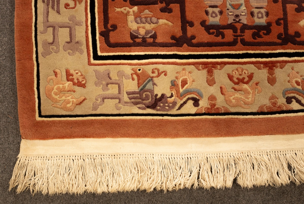 A Chinese superwash rug, the peach field with vases and centred by an ivory medallion of dragons, - Image 3 of 4