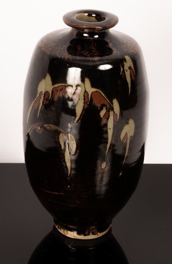 Jim Malone (born 1946), a stoneware vase, footed ovoid vessel with flared lip, tenmoku glaze,