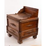 A late 19th Century Tramp/Folk Art oak chest or coffer, with central lift-top panel,