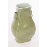 A Chinese monochrome celadon porcelain vase with two handles, Guaner Fanghu, Qing Dynasty,