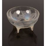 A Lalique Lys bowl, opalescent glass with etched and moulded signatures, on four feet,