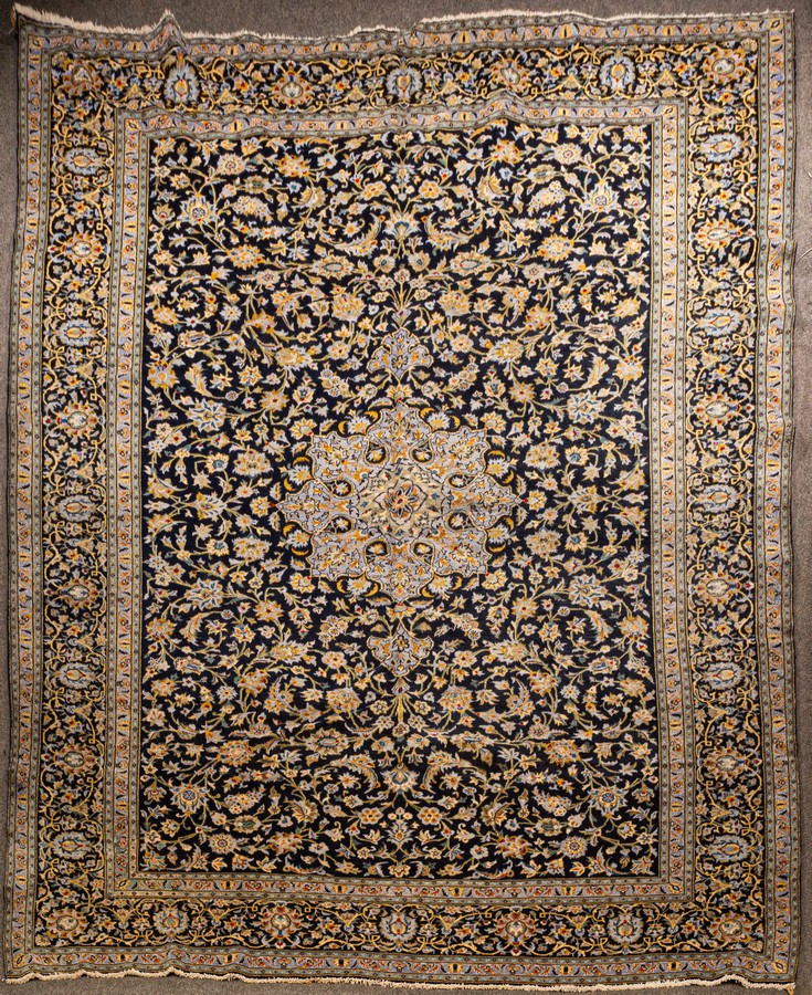 A Kashan carpet, central Persia, indigo field with flowering vines,