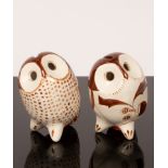 A pair of novelty pottery money boxes, Cornish school, in the form of owls, painted decoration,