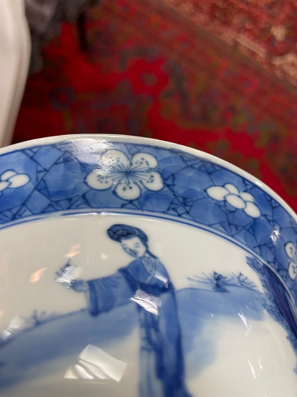 A Chinese blue and white porcelain bowl, Kangxi, depicting ladies and a boy playing in the garden, - Image 8 of 10