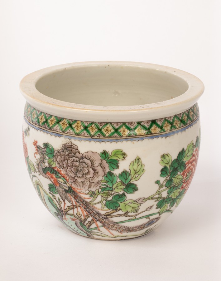 A Chinese famille rose bowl, Juangang, Guangxu, decorated with a phoenix on a rock among peonies,