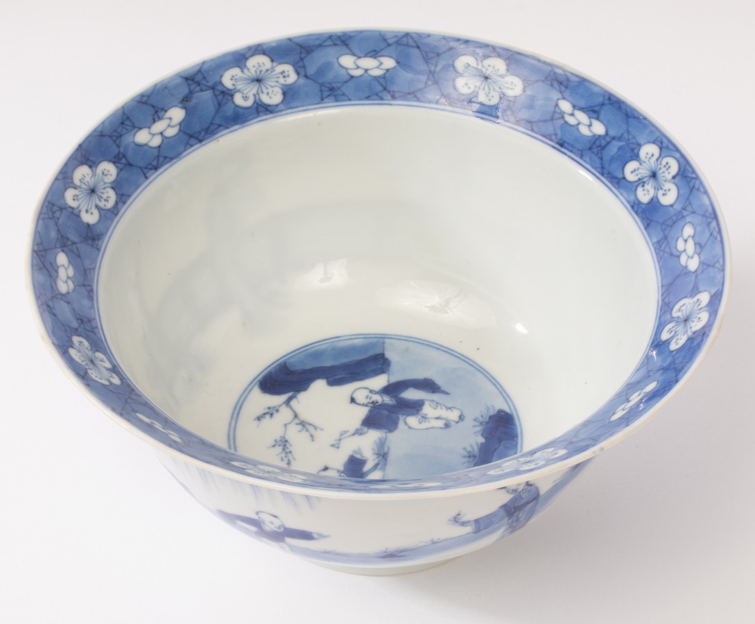 A Chinese blue and white porcelain bowl, Kangxi, depicting ladies and a boy playing in the garden, - Image 3 of 10