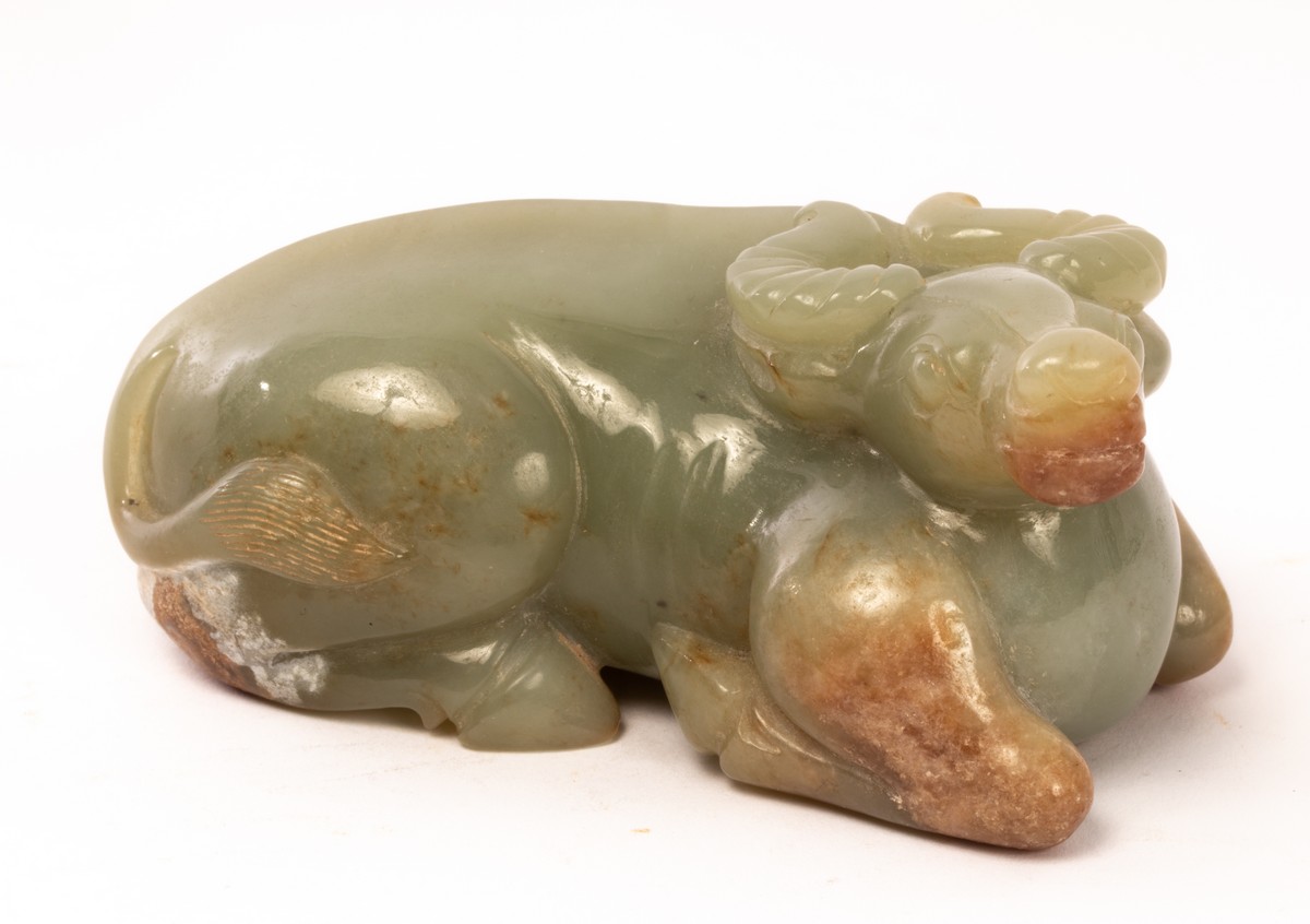 A Chinese celadon jade recumbent buffalo, 19th/20th Century, - Image 2 of 4