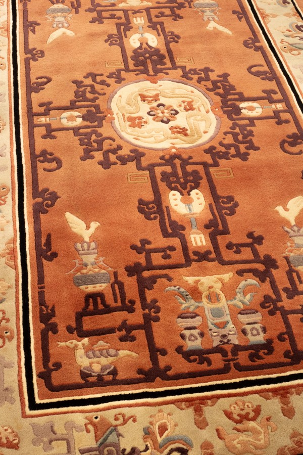 A Chinese superwash rug, the peach field with vases and centred by an ivory medallion of dragons, - Image 2 of 4