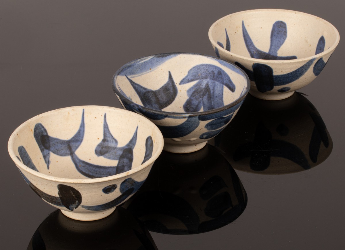 Geoffrey Eastop (British 1921-2014), three stoneware footed bowls, painted blue slips,
