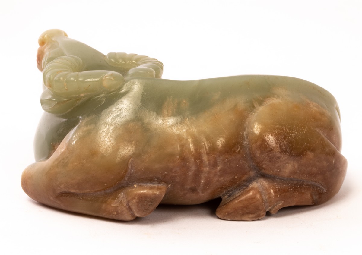 A Chinese celadon jade recumbent buffalo, 19th/20th Century, - Image 3 of 4