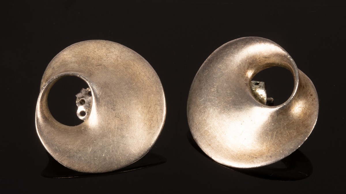 A pair of Georg Jensen style silver earnings of organic form, stamped 925 verso, 24mm diameter,