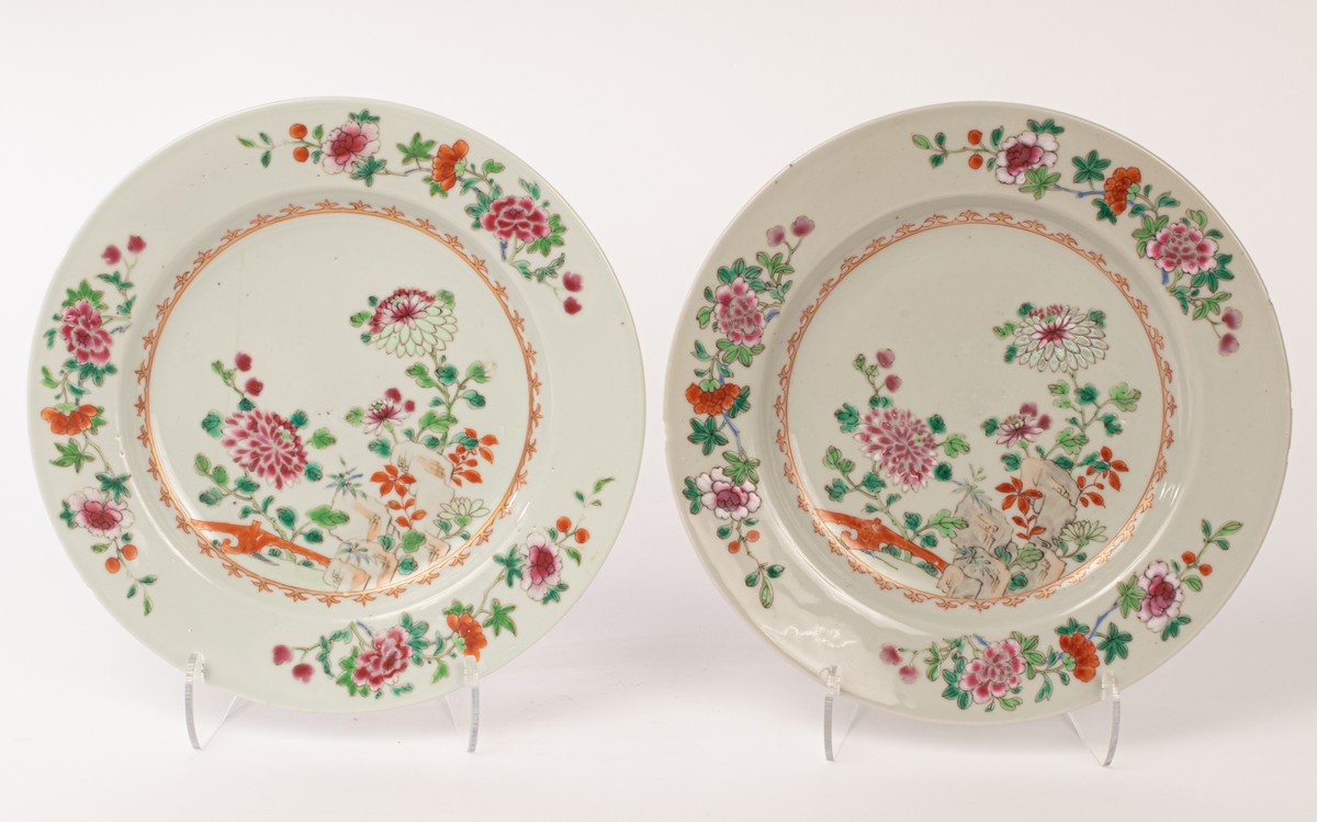 A pair of Chinese famille rose porcelain plates, Qianlong, decorated with chrysanthemums, peonies,