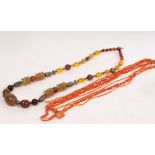 A faux agate bead necklace and a faux coral necklace,